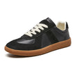 Black suede and leather lace-up sneaker with gum sole, side view