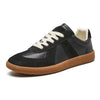Black suede and leather lace-up sneaker with gum sole, side view