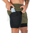 Army green compression shorts close-up showing zippered phone pocket on side