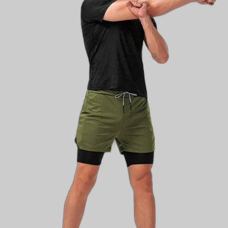 Men's army green compression shorts full body view with built-in black compression liner on grey background
