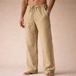 Man wearing cream linen drawstring pants with side pocket