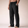 Man wearing black linen drawstring pants with side pocket