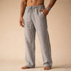 Man wearing gray linen drawstring pants with side pocket
