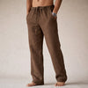 Man wearing brown linen drawstring pants with side pocket
