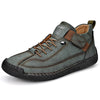 Dark green leather lace-up sneaker with hook-and-loop strap, three-quarter view