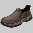 Dark brown leather slip-on shoe with rugged lugged sole, three-quarter view