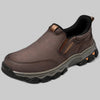 Dark brown leather slip-on shoe with rugged lugged sole, three-quarter view