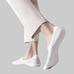 White invisible socks on feet - front view inside canvas shoes
