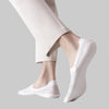 White invisible socks on feet - front view inside canvas shoes