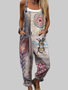Woman wearing a multicolor patchwork overall jumpsuit with bee embroidery detail