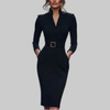 Woman wearing a black belted midi dress with stand collar