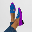 Blue suede-look moccasin flats on a model's feet