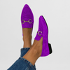 Purple suede-look moccasin flats on a model's feet