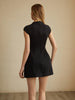 Back view of a black mini dress showing the zip closure and vertical seaming