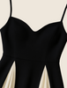 Detail of black and cream contrast pleated skirt panels
