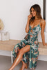 Woman smiling in a green floral maxi dress with cutout waist detail