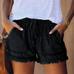 Women's black denim frayed hem shorts with drawstring waist and front patch pockets