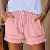 Women's pink denim frayed hem shorts with drawstring waist and front patch pockets