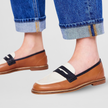 Brown moccasin loafers with horsebit buckle detail