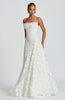 Women in a white spaghetti strap maxi dress - full length elegant front view