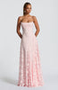 Women in a pink spaghetti strap maxi dress - full length front view