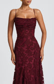 Wine red evening maxi dress - side view with elegant floor-length drape