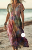 Woman wearing a mauve watercolor print dress