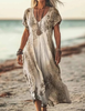 Woman wearing a beige paisley print dress