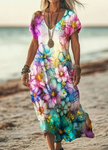 Woman wearing a rainbow watercolor floral print dress