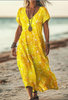Woman wearing a yellow citrus print dress