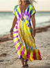 Woman wearing a yellow and purple tie-dye print dress