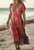 Woman wearing a red boho patterned dress