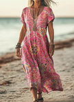 Woman wearing a pink boho patterned dress