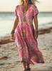 Woman wearing a pink boho patterned dress