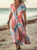 Woman wearing a pastel rainbow tie-dye print dress