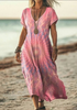 Woman wearing a peach tie-dye print dress