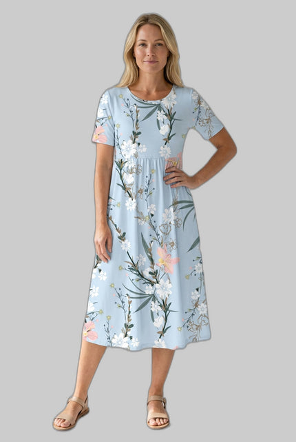 Woman in a light blue floral midi dress with round neckline and short sleeves, front view on gray background