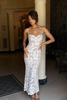 Front view of a white lace bodycon dress with scalloped sweetheart neckline