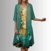 Model in jade green layered midi set with sheer chiffon cardigan over golden floral abstract-print slip dress