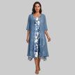 Woman in blue floral layered midi dress set with sheer cardigan over slip dress, gray studio background