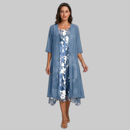 Woman in blue floral layered midi dress set with sheer cardigan over slip dress, gray studio background