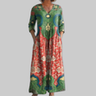 Woman wearing a green vintage floral print maxi dress