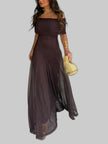 Woman wearing a brown off-shoulder maxi dress with a sheer layered skirt