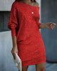 Woman wearing a red off-shoulder sequin mini dress