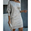 Woman wearing a silver off-shoulder sequin mini dress