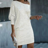 Woman wearing a white off-shoulder sequin mini dress
