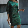 Woman wearing a dark green off-shoulder sequin mini dress