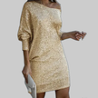 Woman wearing a bright gold off-shoulder sequin mini dress
