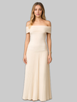 Woman wearing a beige off-shoulder pleated maxi dress