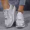 Silver metallic slip-on flat shoe on a model's feet